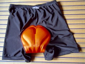 オレンジ色のパッド付き薄手ジャージ生地パンツ